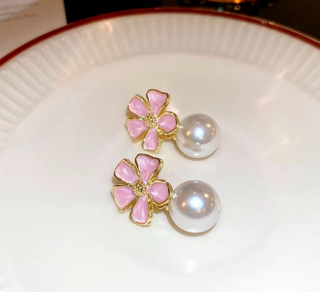Pink enamel flower with pearl drop dangler earrings