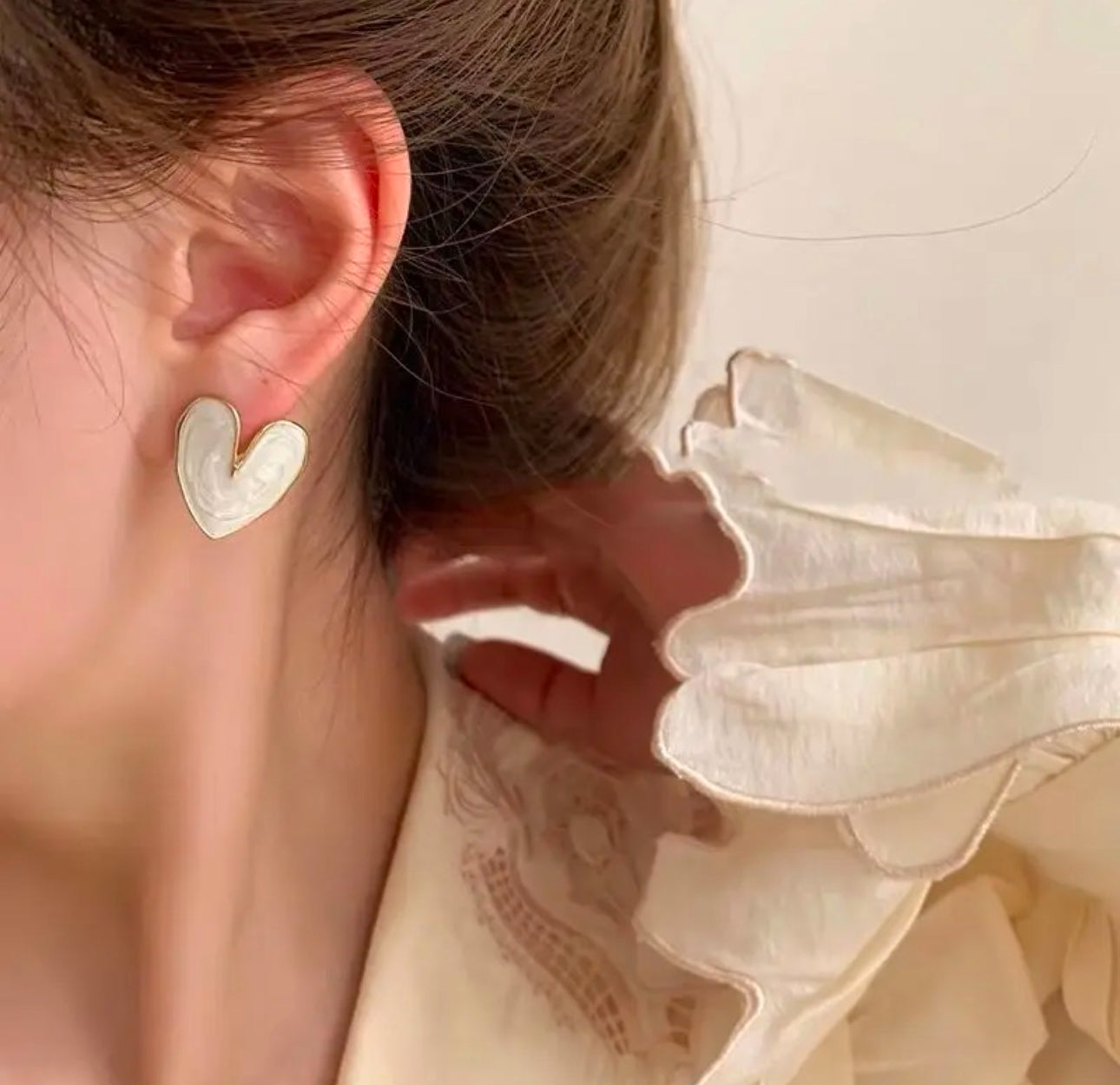 White enamel heart stud earrings