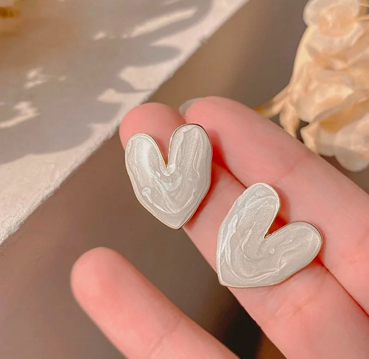 White enamel heart stud earrings