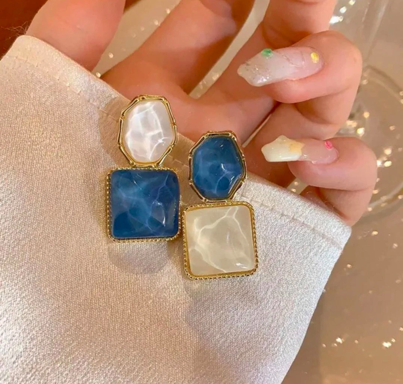 Blue and white stone dangler earrings