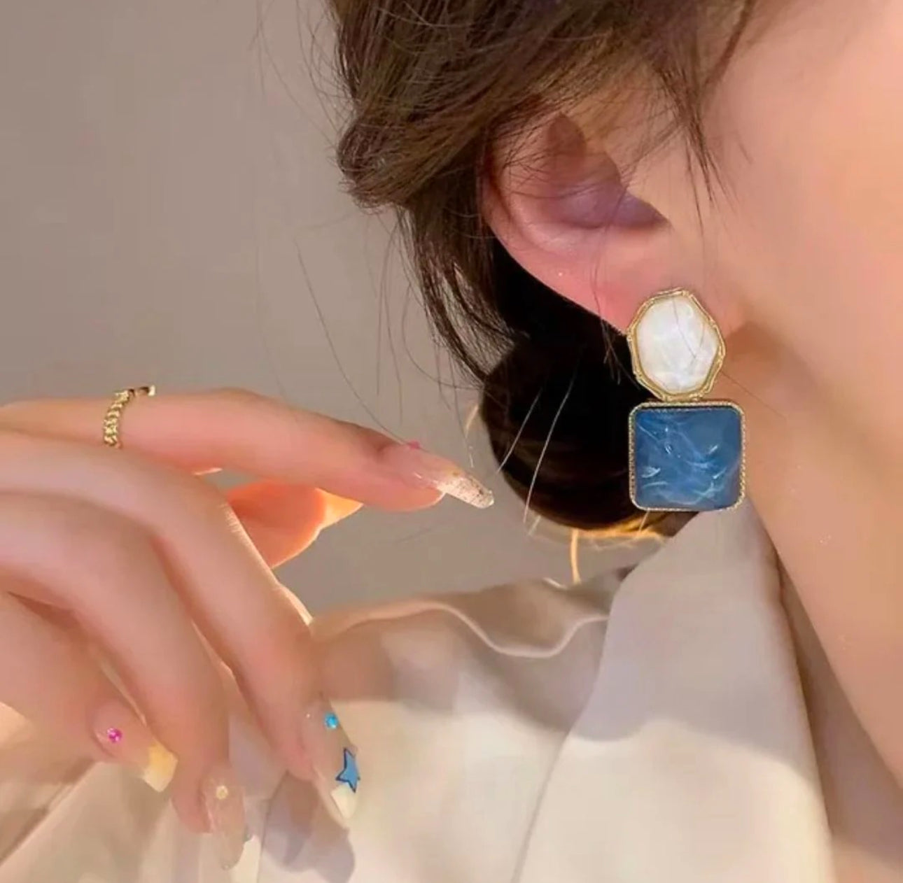 Blue and white stone dangler earrings