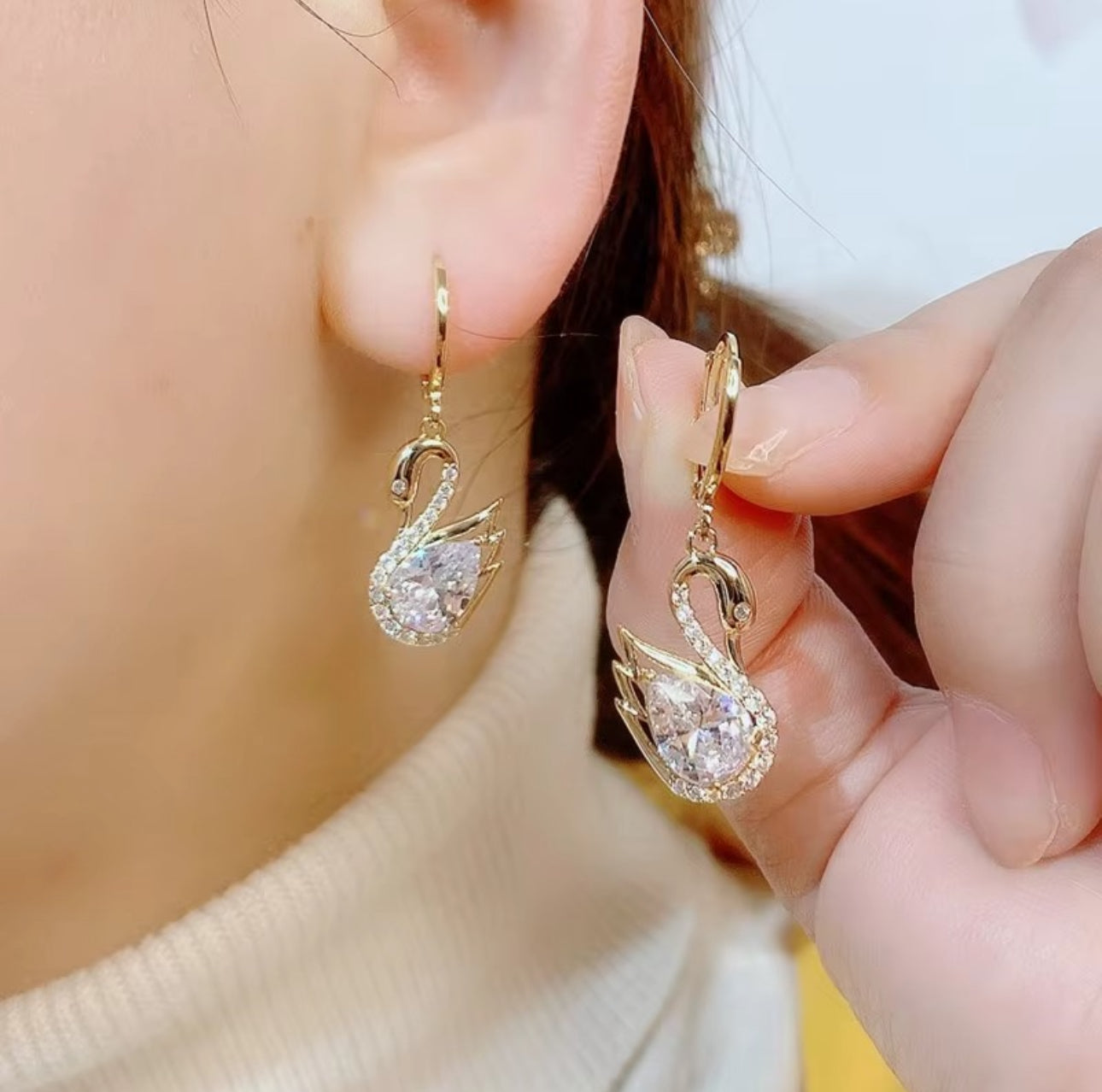 .Swan huggie earrings