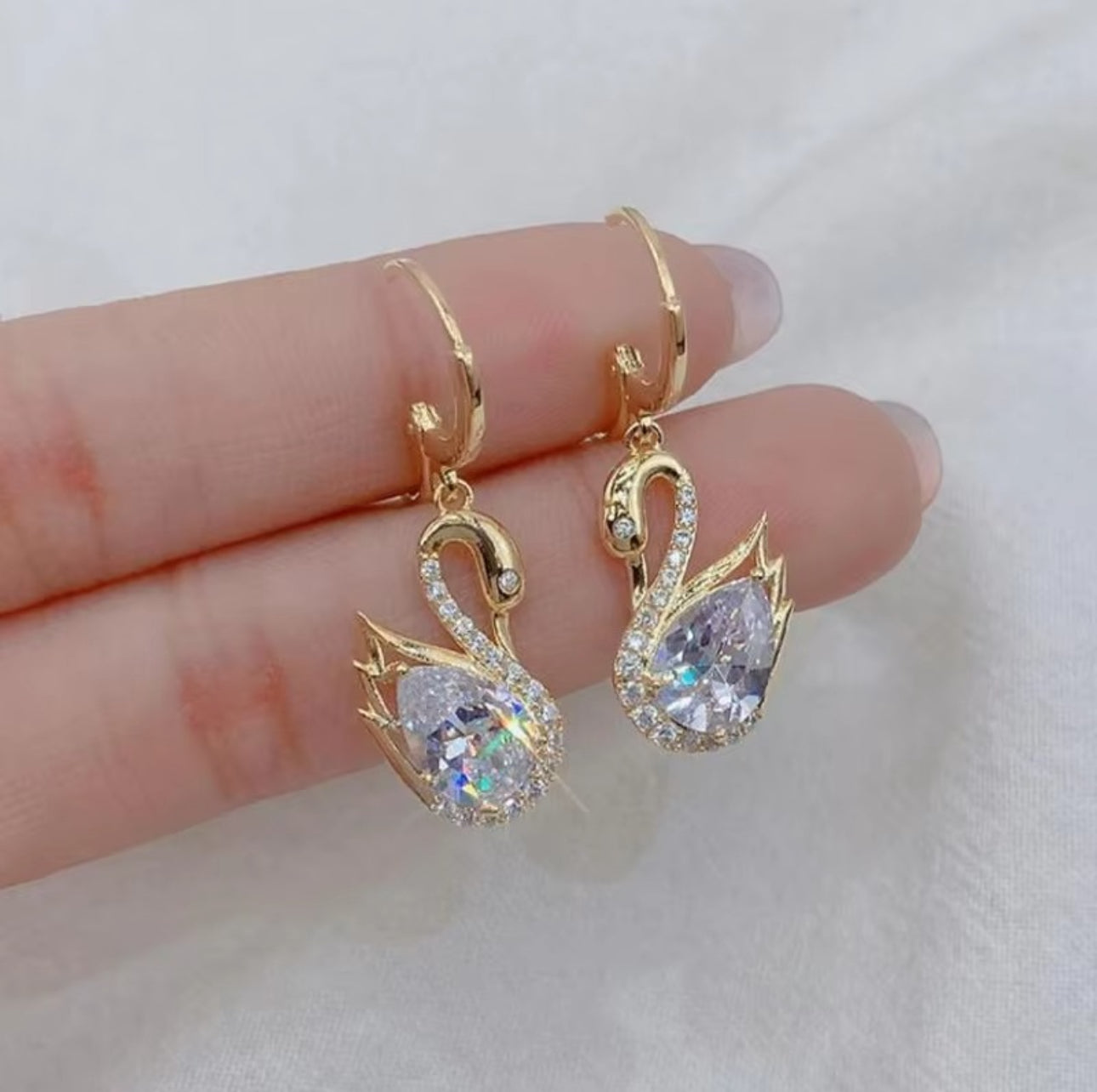 .Swan huggie earrings