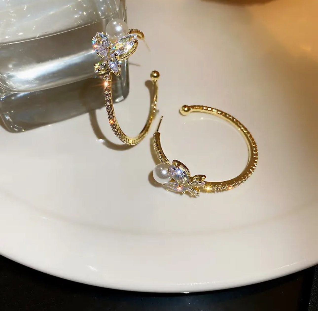 . Gold crystal butterfly hoop earrings