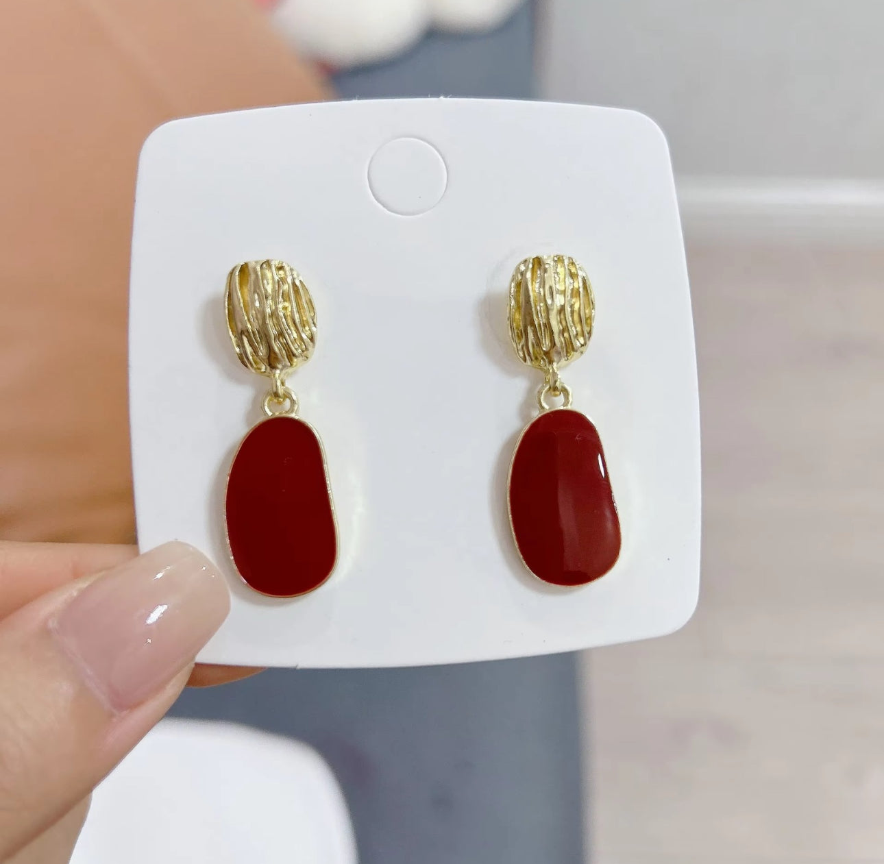 Red enamel drop golden earrings