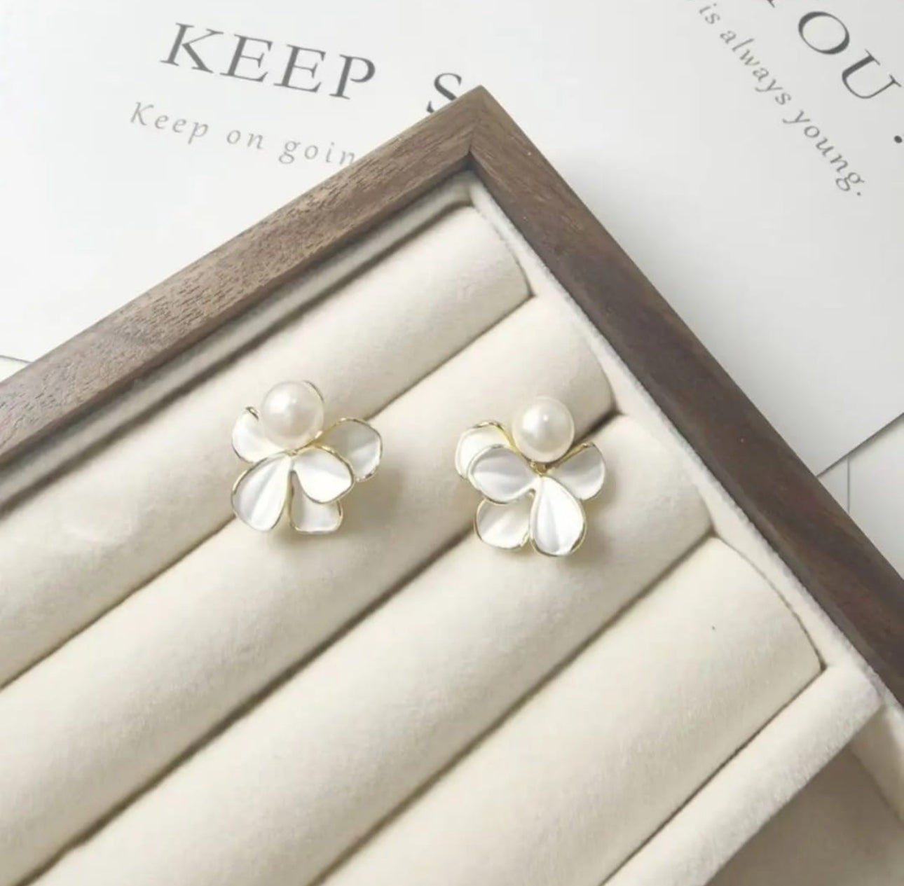 White enamel flower with pearl drop stud earrings