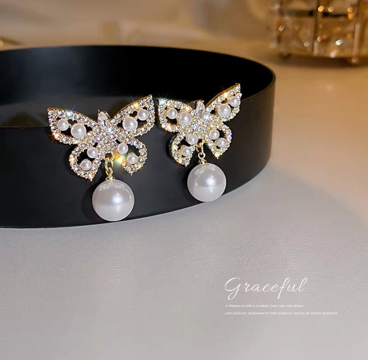 Stone and Pearl butterfly stud earrings