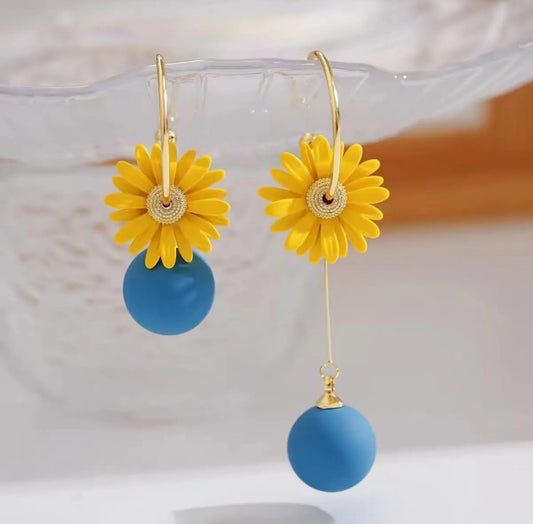 . 2 blue and yellow contrasting earrings